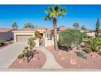 Attractive single-story home with beautiful desert landscaping, sidewalk and private courtyard at 23216 N Gaviota Dr, Sun City West, AZ 85375