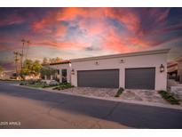 Charming home featuring desert landscaping, a two-car garage, and a beautiful terracotta tile roof at 2421 E Montebello Ave, Phoenix, AZ 85016