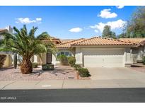 Charming home with a well-maintained front yard and attached two-car garage at 4546 E Villa Rita Dr, Phoenix, AZ 85032
