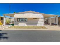 Charming single-story home with a covered front patio and carport, showcasing a cozy and inviting exterior at 9333 E University Dr # 113, Mesa, AZ 85207