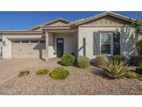 Charming single-story home featuring desert landscaping, a two-car garage, and inviting front entry at 10134 E Supernova Dr, Mesa, AZ 85212