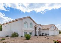 Charming two-story home with an attached three-car garage and a well-maintained yard at 2257 E Lockwood St, Mesa, AZ 85213