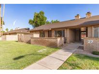 Charming single-story brick home with a well-maintained front lawn and cozy entrance at 27 W Concorda Dr # 104, Tempe, AZ 85282