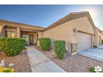 A charming single-story home with desert landscaping, covered entry, and a two-car garage at 846 N Pueblo Dr # 119, Casa Grande, AZ 85122