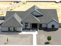 Expansive single-story home boasts gravel landscaping and gray shingles at 34949 N Donald Way, San Tan Valley, AZ 85140