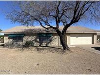 Charming single-story home featuring a two-car garage and low maintenance front yard at 4741 W Annette Cir, Glendale, AZ 85308