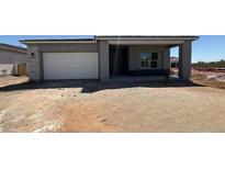 New construction single-Gathering home featuring a two-car garage and covered entry in a developing community at 11429 E Utah Ave, Mesa, AZ 85212