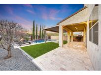 View of backyard featuring a pool with an attached covered patio at 3038 W Woburn Ln, Phoenix, AZ 85085