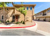Charming two-story townhome featuring well-kept landscaping, an inviting entryway, and an attractive exterior finish at 1225 N 36Th St # 2081, Phoenix, AZ 85008
