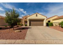 Charming single-story home featuring a well-maintained yard and a two-car garage at 12930 W Chapala Dr, Sun City West, AZ 85375