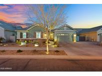 Charming home with a well-manicured front yard and inviting exterior lighting at 2617 S Jeffry St, Gilbert, AZ 85295