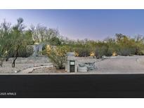 Well-manicured front entrance with desert landscaping, stone walkway, and clearly displayed house number at 8644 E Sweetwater Ave, Scottsdale, AZ 85260