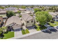 Charming two-story home featuring tile roof and well-maintained landscaping near a playground at 927 W Azalea Pl, Chandler, AZ 85248