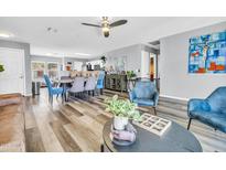 Open-concept living and dining room with modern furniture and decor, great for entertaining at 8972 E Arizona Park Pl, Scottsdale, AZ 85260