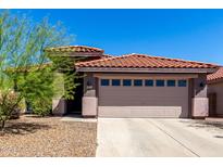 Inviting home featuring a well-maintained landscape and a classic red tile roof at 12415 N 41St Dr, Phoenix, AZ 85029
