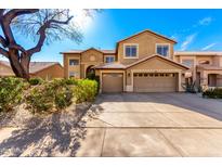 Charming two-story home featuring a spacious driveway, two-car garage, and mature landscaping at 1344 N Constellation Way, Gilbert, AZ 85234