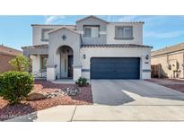 Charming two-story home with a stylish two-car garage, a landscaped yard, and a welcoming front entrance at 15856 N 76Th Ave, Peoria, AZ 85382