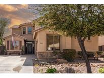 Charming two-story home with well-maintained landscaping, beautiful stone accents, and a welcoming front yard at 21557 N Anne Ln, Maricopa, AZ 85138