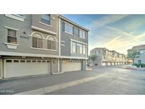 Exterior of a condo featuring a garage, windows, and neutral-toned paint at 2402 E 5Th St # 1532, Tempe, AZ 85288