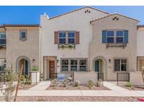 Charming two-story townhomes with stucco exteriors, colorful shutters and landscaped front yards at 2658 S Sulley Dr # 102, Gilbert, AZ 85295