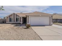 Charming single-story home featuring a two-car garage and low maintenance desert landscaping at 3327 W Mohawk Ln, Phoenix, AZ 85027