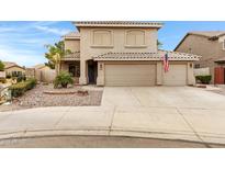 Charming two-story home with a three-car garage and well-maintained landscaping at 9665 E Nido Ave, Mesa, AZ 85209