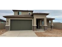 Well-maintained single-Gathering home featuring a spacious two-car garage and a desert landscape at 15146 W Gray Fox Trl, Surprise, AZ 85387