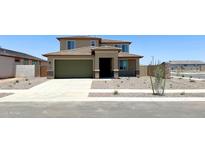 Charming two-story home with a green garage door, neutral tones, and tidy xeriscaped front yard at 15146 W Gray Fox Trl, Surprise, AZ 85387