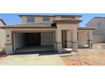 Two story home with a two car garage and desert landscaping at 15151 W Gray Fox Trl, Surprise, AZ 85387