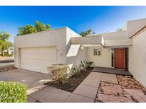 Charming single-story home with a well-maintained front yard and attached garage at 13814 N 43Rd St, Phoenix, AZ 85032