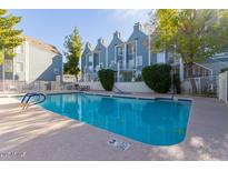 Inviting pool area with a 'No Diving' section, accompanied by nearby seating and attractive community buildings at 1505 N Center St # 220, Mesa, AZ 85201
