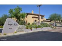 Street view of the Vintage at Grayhawk community, featuring attractive landscaping and architecture at 20121 N 76Th St # 2064, Scottsdale, AZ 85255