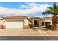 Inviting single-story home with a two-car garage and desert landscaping at 2101 S Meridian Rd # 26, Apache Junction, AZ 85120