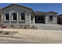Charming single-story home featuring a tiled roof and desert landscaping for low maintenance appeal at 21846 E Bonanza Ct, Queen Creek, AZ 85142