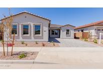 Charming single-story home with desert landscaping, a tile roof, and a paved driveway at 21846 E Bonanza Ct, Queen Creek, AZ 85142