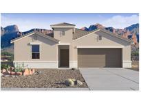 Charming single-story home with desert landscaping and a two-car garage against a mountain backdrop at 2304 W Storia Ave, Apache Junction, AZ 85120