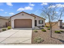Charming single-story home featuring a two-car garage and low maintenance desert landscaping at 3309 E Malibu Dr, San Tan Valley, AZ 85143