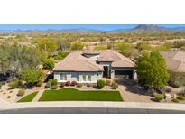 Beautiful single-Gathering home with well-maintained landscaping and a desert backdrop under a clear blue sky at 5414 E Palo Brea Ln, Cave Creek, AZ 85331