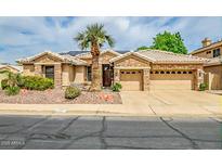 Charming single-story home with stone accents, desert landscaping, and a well-manicured front yard at 6158 W Donald Dr, Glendale, AZ 85310