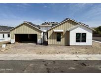 New construction shows a charming single-Gathering home with a two-car garage and neutral colors at 6460 E Omega Cir, Mesa, AZ 85215