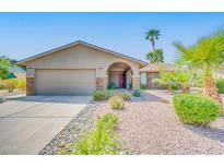 Charming single-story home with a well-maintained yard and a two-car garage at 10543 E Sahuaro Dr, Scottsdale, AZ 85259