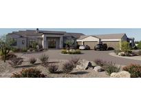 Stunning stucco home featuring an expansive driveway, three-car garage, and lush desert landscaping at 12863 E Cochise Rd, Scottsdale, AZ 85259