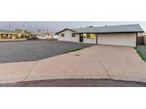 Charming single-story home with a well-maintained front yard and inviting entrance with a gravel yard at 1718 S Marilyn Ann Dr, Tempe, AZ 85281