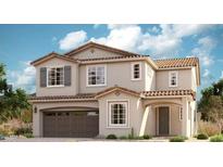 Charming two-story home featuring a tile roof, arched entryway, and a spacious two-car garage at 21830 E Bonanza E Ct, Queen Creek, AZ 85142