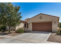 Charming single-story home featuring a spacious driveway, low-maintenance landscaping, and a welcoming facade at 240 N Monterey Ct, Casa Grande, AZ 85194