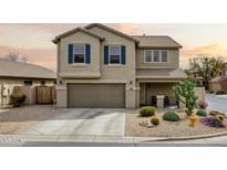 Charming two-story home featuring a desert landscape, two-car garage, and cozy covered porch at 4415 E High Point Dr, Cave Creek, AZ 85331