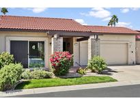 Charming single-story home with a well-manicured lawn and a tile roof at 5346 N 78Th Way, Scottsdale, AZ 85250