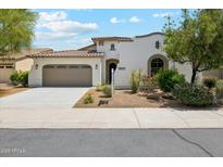Charming single-Gathering home with a well-manicured lawn and a two-car garage in a suburban neighborhood at 18001 W Cassia Way, Goodyear, AZ 85338
