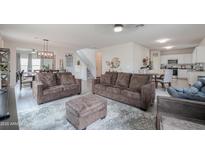 Bright and spacious living room with plush sofas, a soft rug, and an open layout at 45108 W Zion Rd, Maricopa, AZ 85139