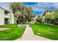 Lush green lawns with mature shade trees and walking paths at 2315 W Union Hills Dr # 120, Phoenix, AZ 85027